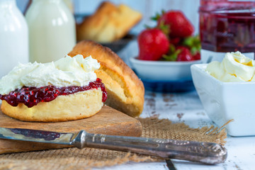 Traditional English scones with strawberry jam and clotted cream