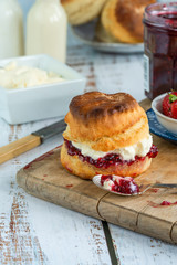Traditional English scones with strawberry jam and clotted cream
