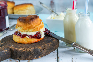 Traditional English scones with strawberry jam and clotted cream