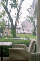 A seat with raining background and green grass