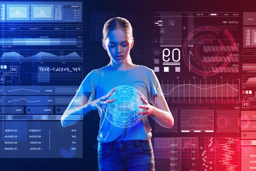3d Earth image. Calm attentive young girl looking attentively at the hologram of the Earth while holding it carefully in her hands