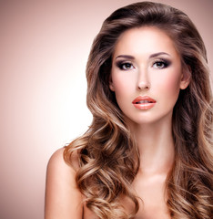 Fototapeta premium Beautiful young woman with gorgeous long hair