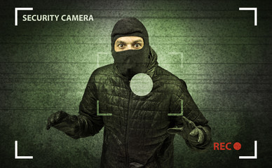 Caught burglar by house camera in action.