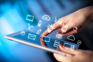 Female hands touching tablet with white technology related icons 