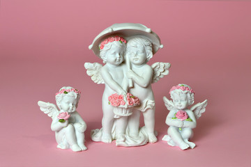 Group of little angels holding flowers