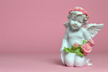 Guardian angel holding flowers
