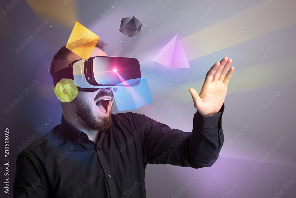 Poster amazed businessman with virtual reality colorful geometric shapes in front of him