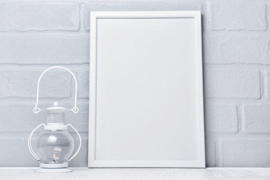 Decorative lantern and mock-up of white frame with copy space for poster