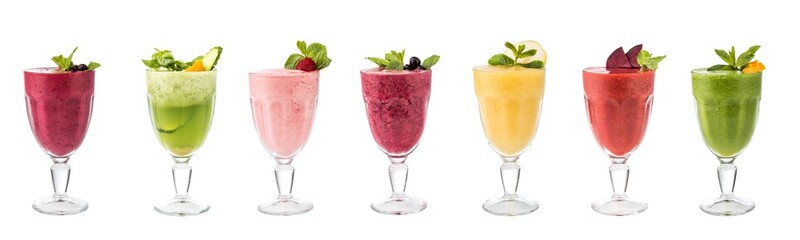 Set of classical fresh delicious smoothies decorated with fruits and berries isolated on white background. Vegan natural healthy drinks