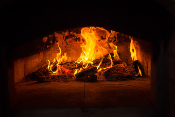 Traditional italian Pizza oven, burning wood and flames in fireplace