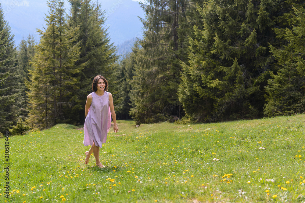 Wall mural Barefooted Woman Walking on Grass