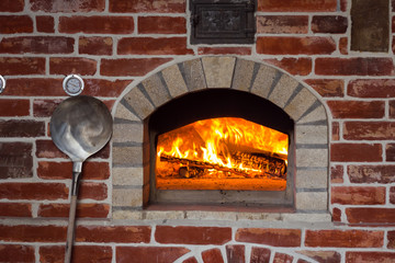 Traditional italian Pizza oven, burning wood and flames in fireplace
