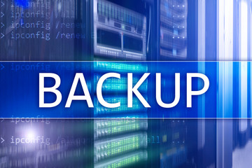 Backup button on modern server room background. Data loss prevention. System recovery.