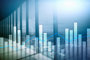 Financial graphs and charts on blurred business center background. Invesment and trading concept.