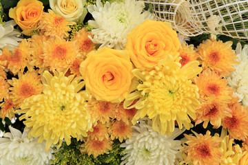 Yellow and white flowers arranged as a natural background image with Rose and Chrysanthemum.