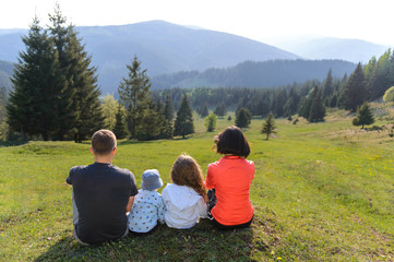 Fototapeta na wymiar Family Enjoying View on Beautiful Landscape