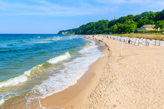 Sea waves on sandy beach in Goehren summer resort, Ruegen island, Baltic Sea, Germany