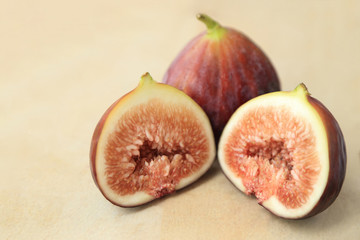 Fresh fruits, figs (Ficus carica) on the wooden plate.