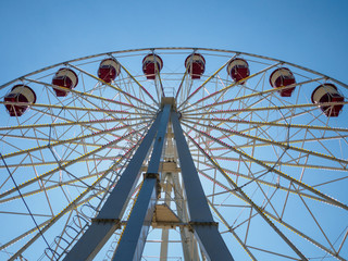 Ferris wheel on sky background