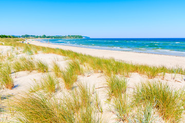 Fototapeta na wymiar View of beach and sand dunes in Lobbe village, Ruegen island, Baltic Sea, Germany