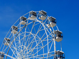 Ferris wheel on sky background