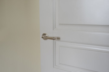 White room door with the silver handle