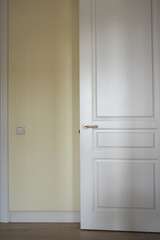 White door in the light beige room.