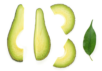 Avocado slices with leaf on white background. Food concept.