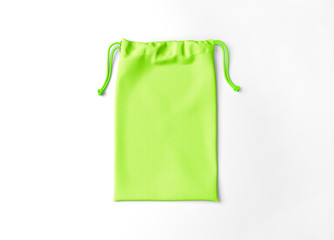 White drawstring bag on background. Fabric cotton small bag. Isolated pouch.