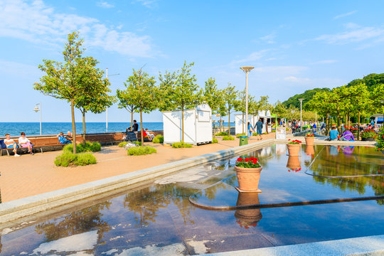 BAABE TOWN, RUEGEN ISLAND - MAY 31, 2018: Park with water fountain and flower pots in Goehren summer resort on Baltic Sea coast, Germany. Ruegen is popular tourist destination in northern Europe.