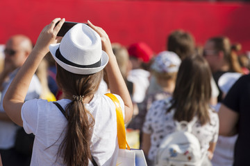 Fototapeta premium Football fans in the fan zone watching the match on the screen