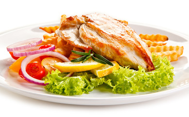 Grilled chicken fillet, chips and vegetable salad