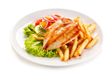 Grilled chicken fillet, chips and vegetable salad