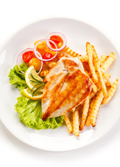 Grilled chicken fillet, chips and vegetable salad
