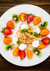 Crepes with fruit and creme