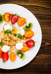 Crepes with fruit and creme