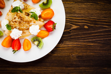 Crepes with fruit and creme