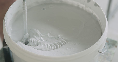 closeup mixing gray decorative concrete plaster