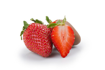 Fresh ripe strawberry covered with milk chocolate isolated on white