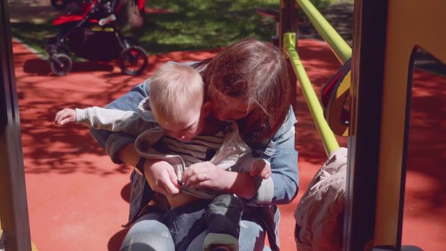 Mom zips her son's jacket