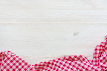 Tablecloth in a cage on a wooden table