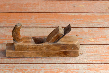 old wooden plane on a bench