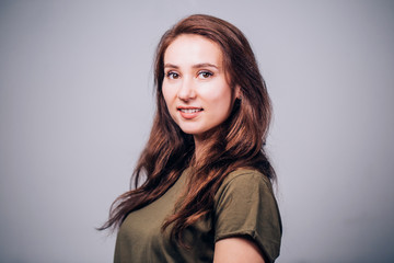Fototapeta premium Happy cheerful young woman looking at camera with joyful and charming smile.