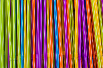 Background of multi-colored drinking straws, close-up