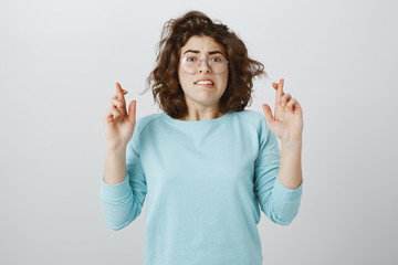Hoping teacher would not pick her to answer near blackboard. Anxious concerned attractive female...