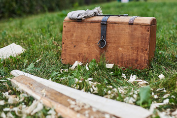 Medieval chest with a handkerchief standing on the grass