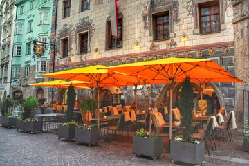 Beautiful road side European restaurant with orange shades and lovely views in Innsbruck, Austria