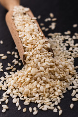 fresh sesame seeds on a rustic background