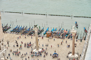 St. Mark's Square with jetties and pillars with the Lion of Saint Mark / Next to the Doges Palace, Venice Italy