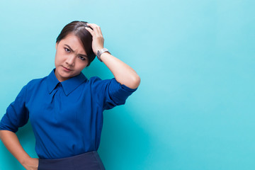 Angry woman standing on isolated blue background